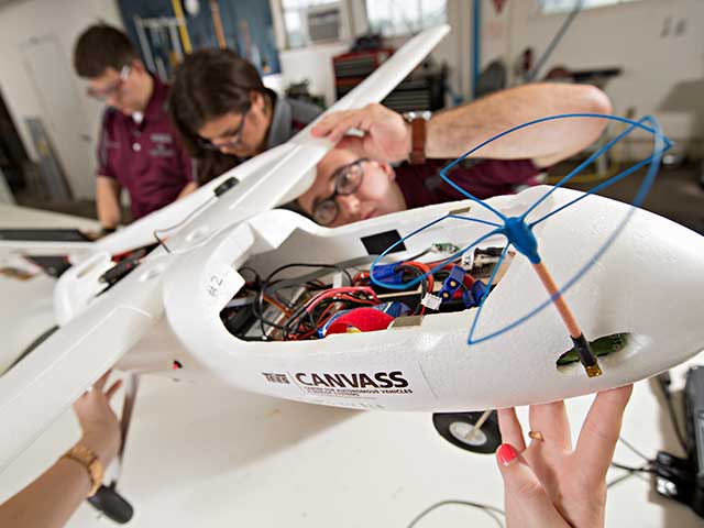 Researcher working on autonomous airplane