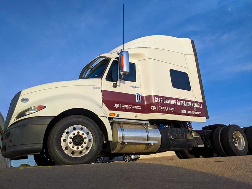Exterior of truck with Texas A&M, TEES and Mechanical Engineer logos and text saying Self-driving Research Vehicle